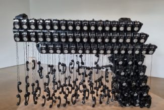 Art installation of hand gun created from old telephones